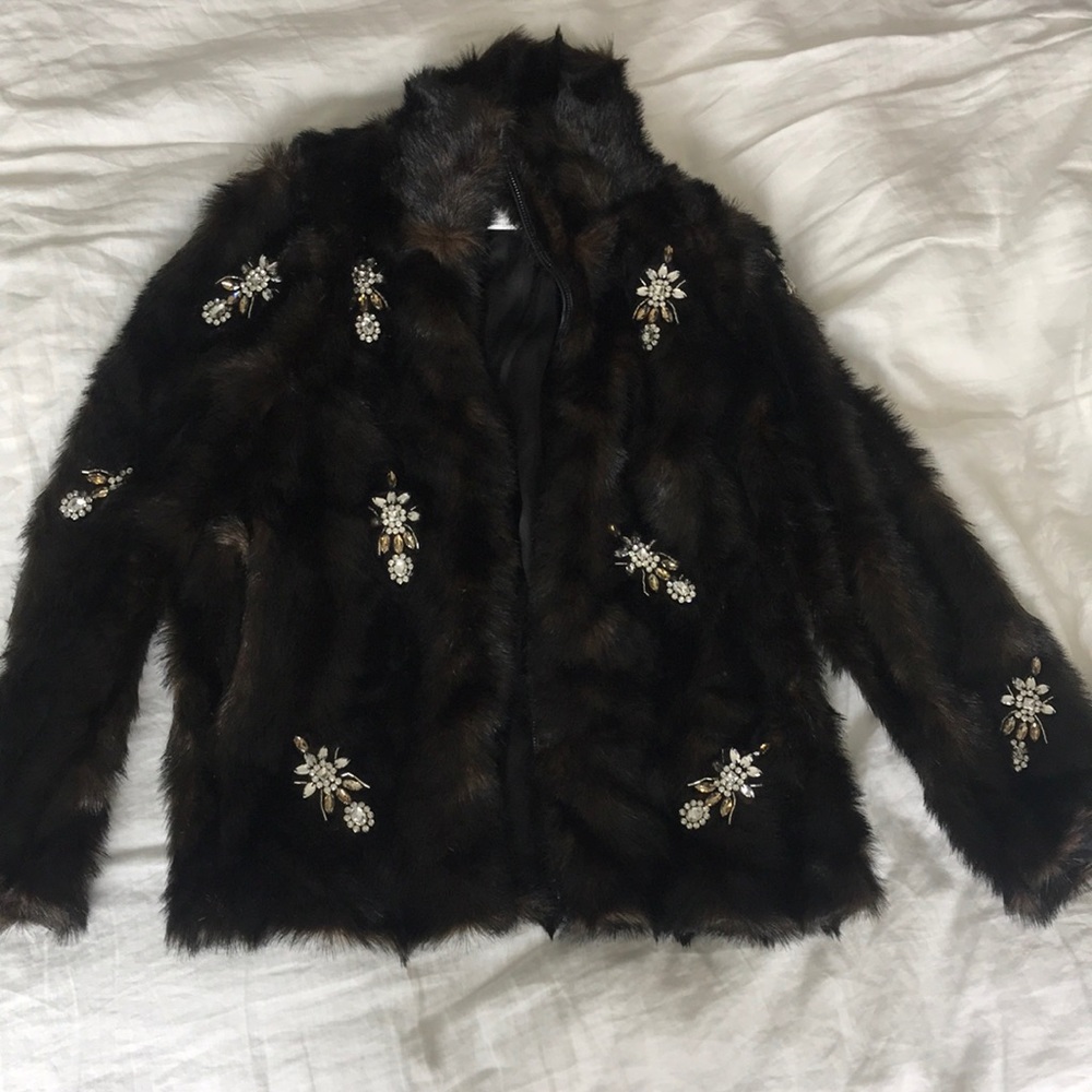 Faux fur with brooches